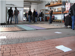 people standing around stamped product samples